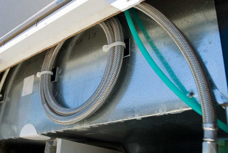 Excess water supply hose coiled up